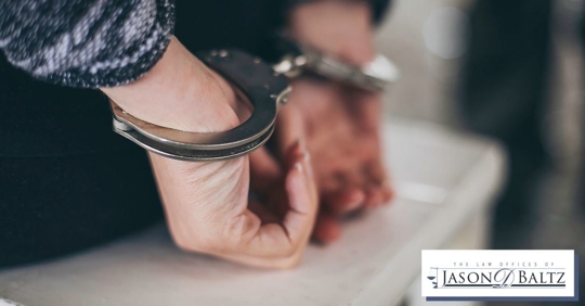 Caucasian woman in handcuffs